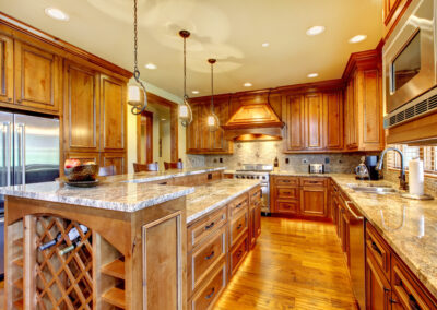 Luxury wood kitchen with granite countertop.